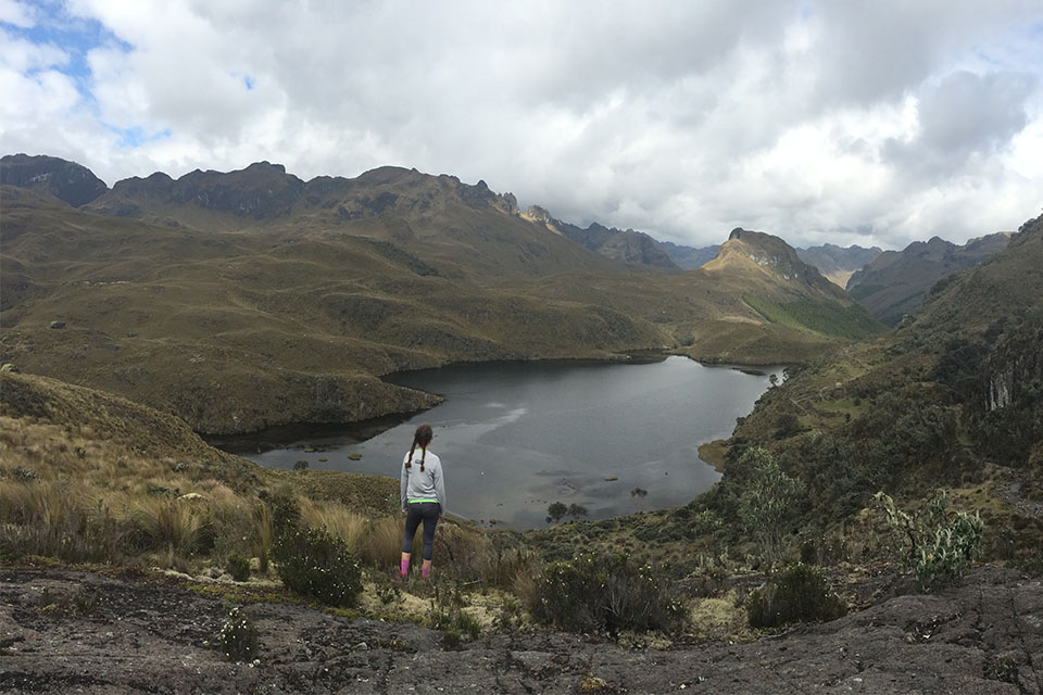 Student overlooking Ecuador landscape