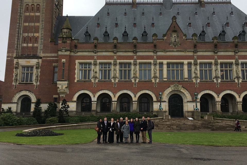 A group of students in front of the Peace Palace in The Hague