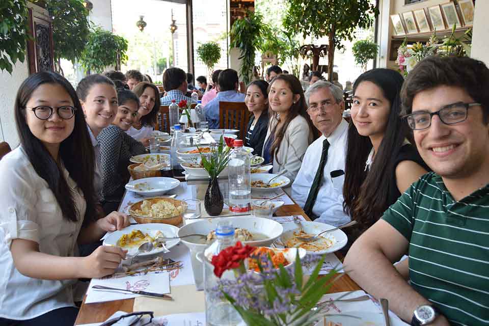 A group of students eating at a restaurant