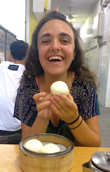 Stephanie Weinstein laughs while eating in Singapore