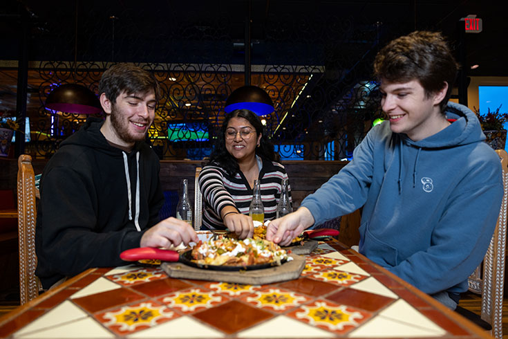 Students sharing a pizza