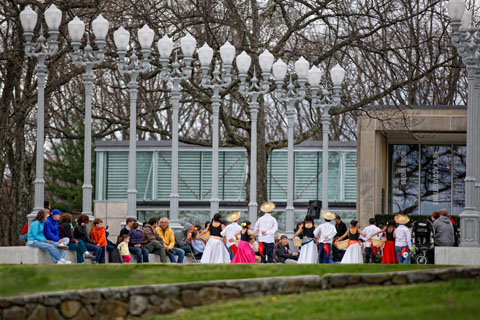 Dancers performing for onlookers in front of the Rose Art Museum.
