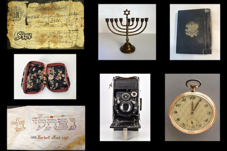 objects including a menorah, pocket watch, and documents