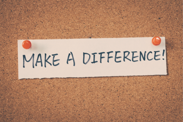 Piece of paper that says "Make a difference" pinned to a corkboard