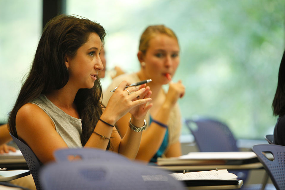 A female student talks in class