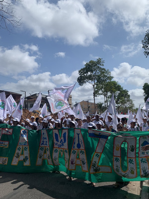 Native Brazilians protesting climate change outside with signs