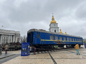 Blue and yellow train car in a swuare