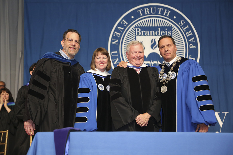 Barry Shrage, the President of Combined Jewish Philanthropies, is awarded an honorary degree in humane letters. From left to right: Cohen Center for Modern Jewish Studies director Leonard Saxe and Provost Lisa Lynch; Barry Shrage; Brandeis President Ron Liebowitz.
