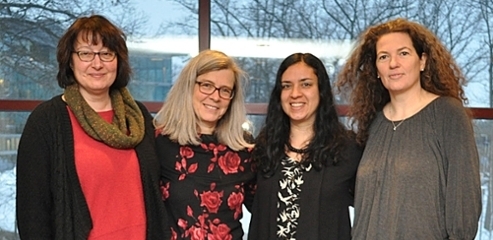 four faculty grant winners linking arms