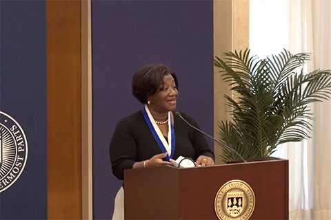 Dr. Tressie McMillan Cottom speaking at a podium