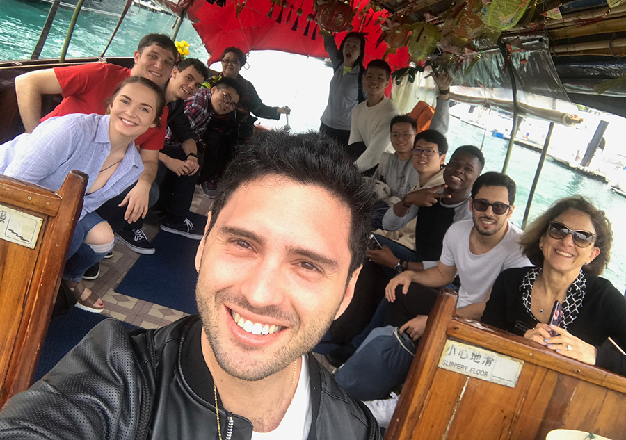 Hassenfeld fellow Tal Richtman, BA/MA '20 and classmates aboard a sampan boat cruise in Hong Kong’s Aberdeen fishing village.