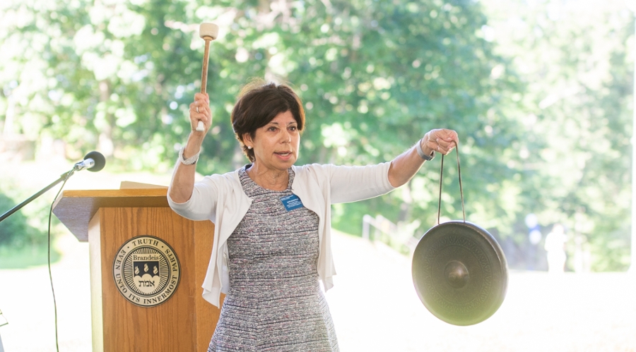 Associate Dean Kate Goldfield struck the gong to ring in the new school year at orientation.
