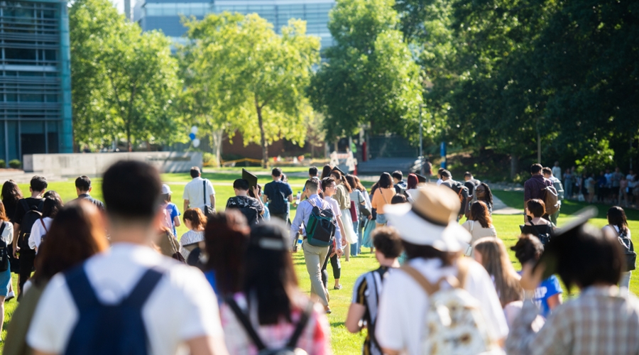 Students walk across campus for orientation.
