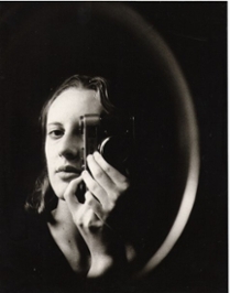 Eva Gurevich taking a self-portrait with an analog camera