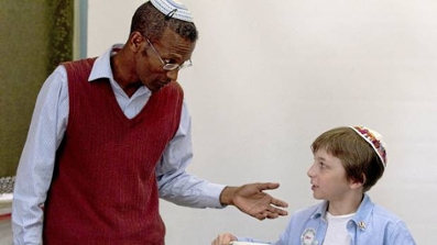 Sharon Shalom teaching a younger boy