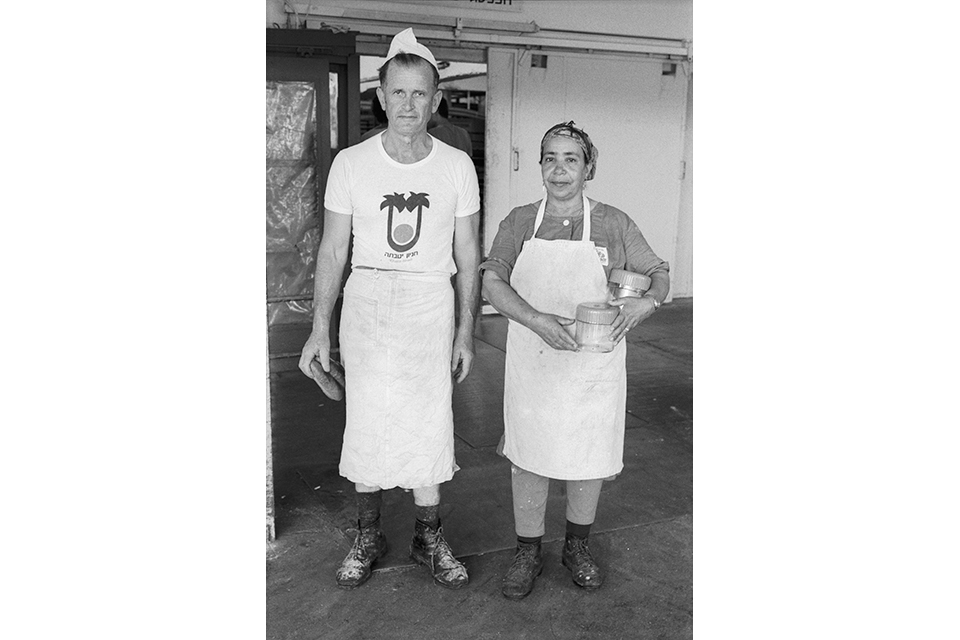 A man and woman in aprons
