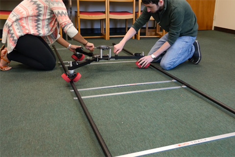 The tracks of a dolly system set up on the floor