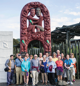A group of people on a Brandeis Travelers trip to Te Puia, New Zealand.