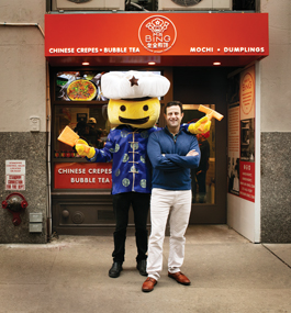 FUN FOOD: Brian Goldberg '99 with the Mr. Bing mascot outside the Chinese creperie's first brick-and-mortar location.