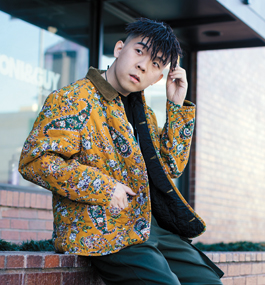 Photo of Jiahuan Xia, wearing a brightly patterned jacket
