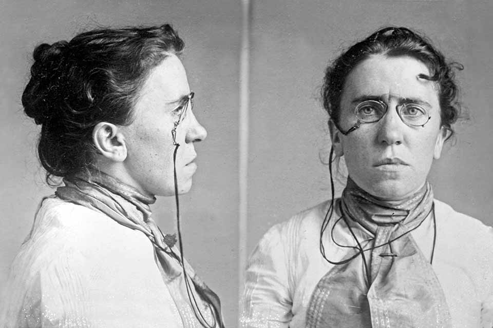 Two side-by-side black and white photos of Emma Goldman, one profile and one of her face
