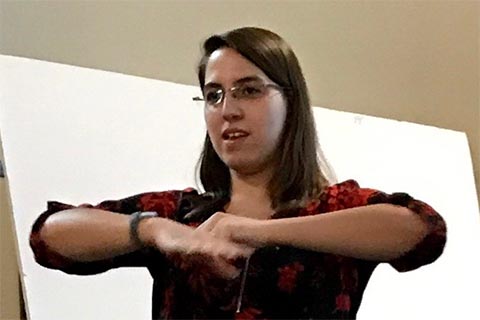 Sarah Zuraw-Weston giving a talk: "The role of particle shape in the deformation and disruption of lipid membranes: Experiments with tunable particle shape and adhesion"