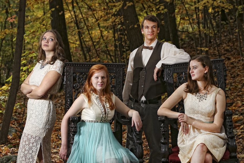 Theater arts students strike a pose in the woods