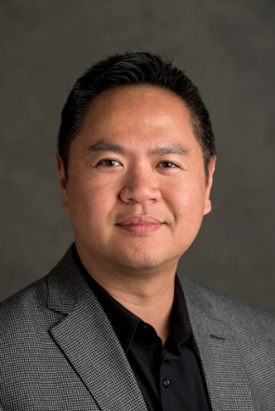 vertical headshot of vice provost of student affairs Raymond Ou