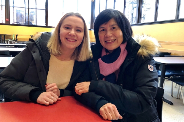 Jordan Loranger '19 with sitting at a table in Sherman with staff member Ling Sze, who she tutors in English