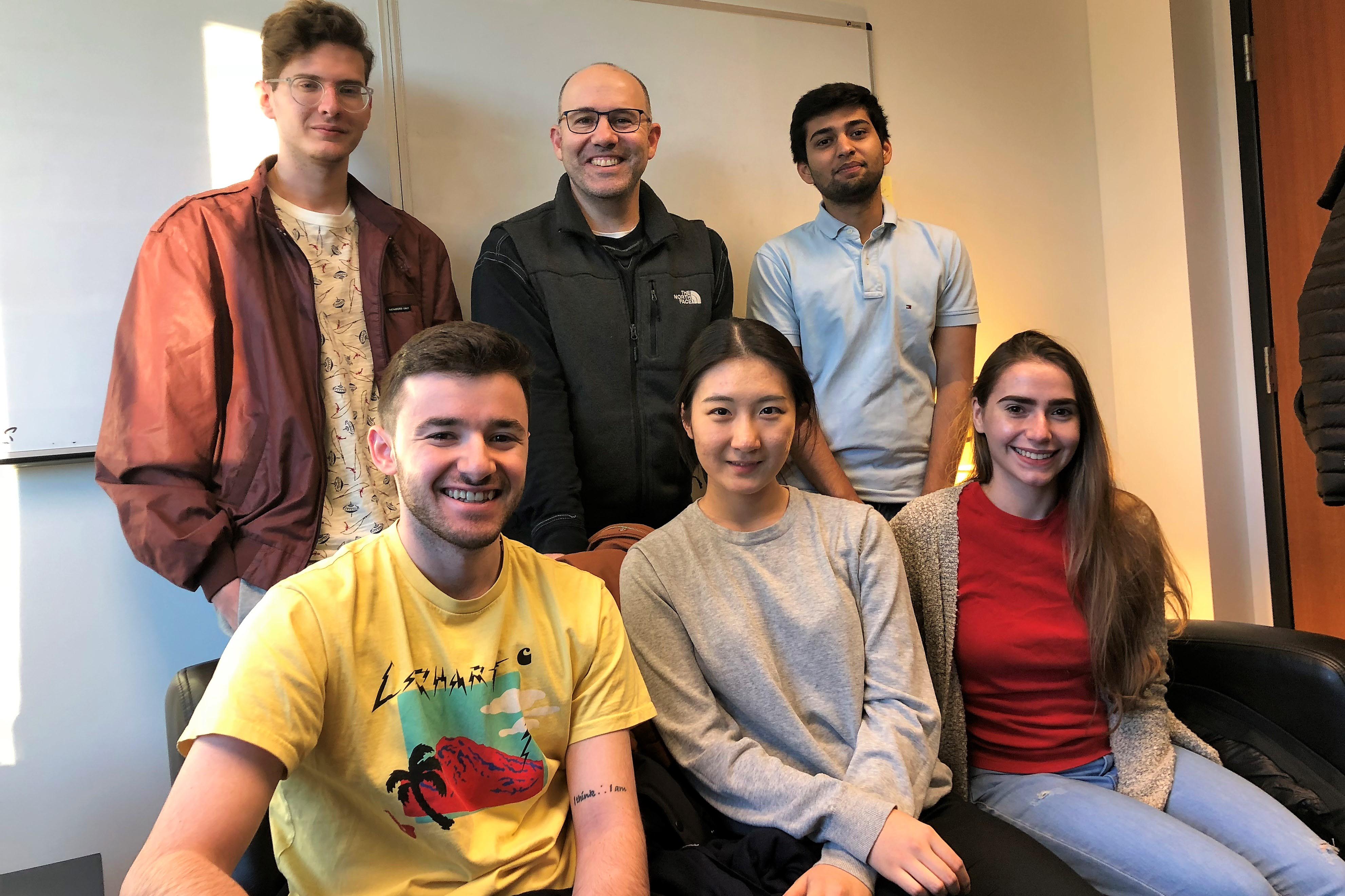 Professor Andy Molinsky with members of his student podcast team, including Kevin Dikdan '20, Manas Maniar '19,Jordan Brodie ‘19, Yuechen Ta '21 and Ali Carney '19.
