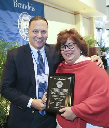 President Ron Liebowitz with Judy Salvucci, who works in the Office of the Provost and received the Lou Ennis Staff Award