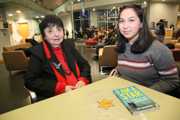 Inge Auervacher seated at a table in the Shapiro Student Center with Mutiara Carney '22