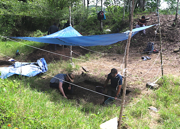Workers excavate the archaeological site
