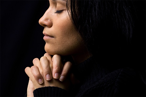 a woman in prayer