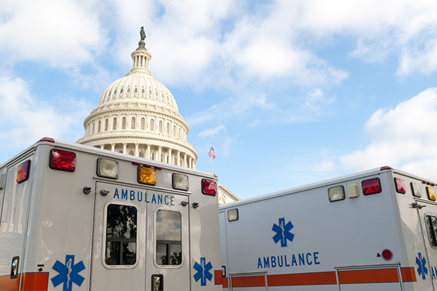 Ambulances parked in front of the capitol building.