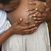 Black lady's pregnant stomach