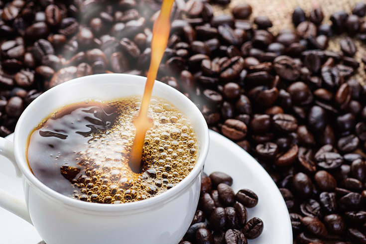 Cup of coffee and coffee beans