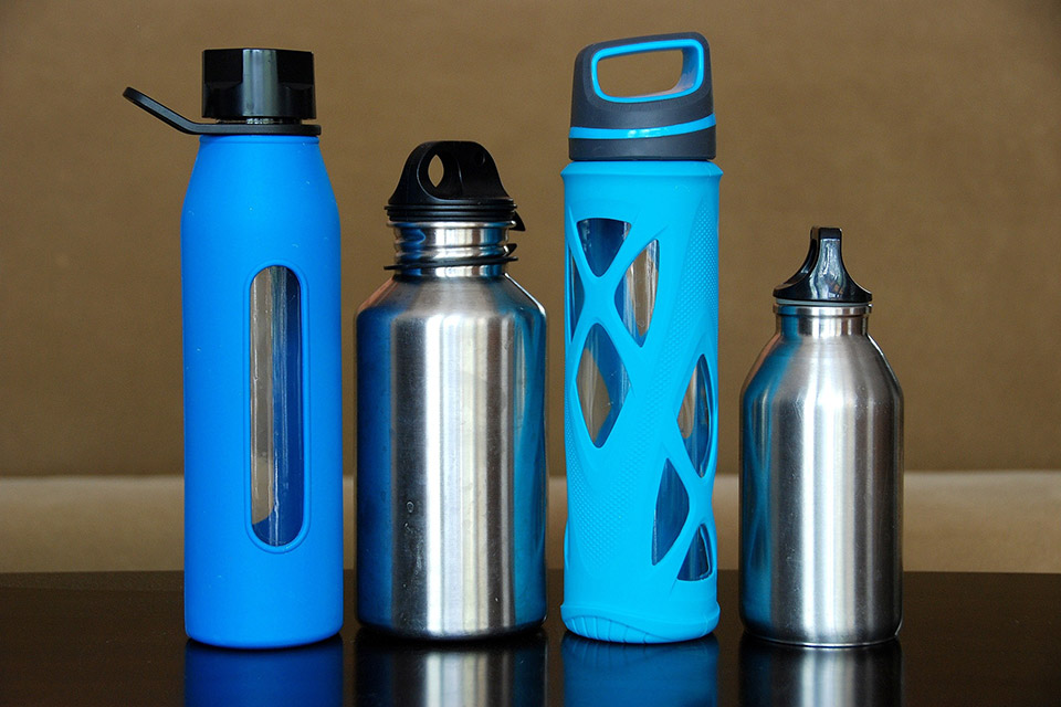 array of reusable drink containers in various primary colors