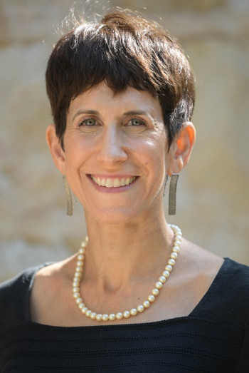 Headshot of Miriam Goldstein in front of a beige background 