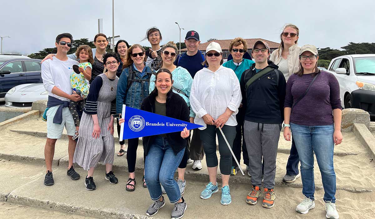 A group of volunteers pose for a photo during a beach clean up in San Francisco