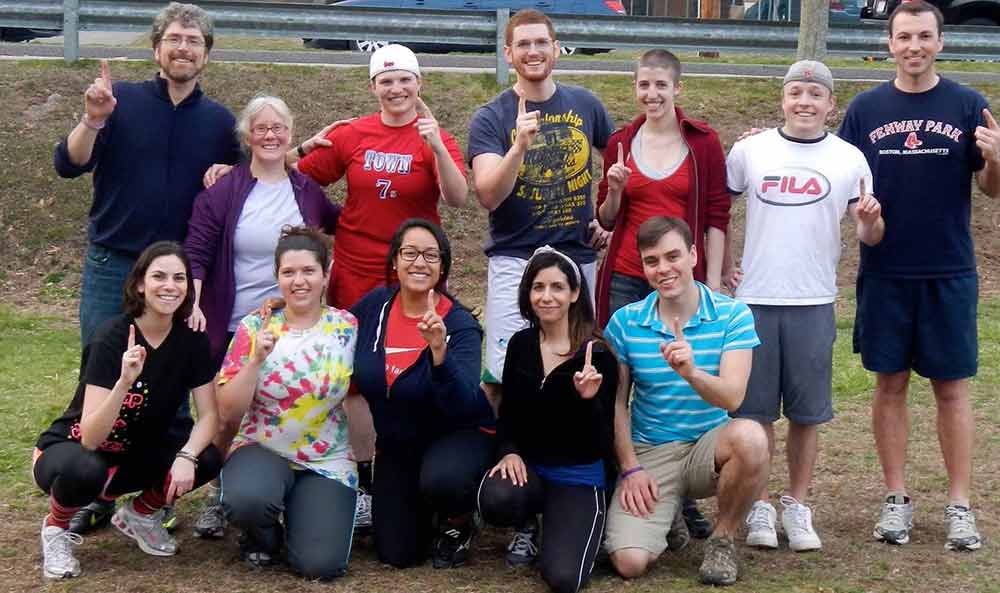 Several people on a field smiling