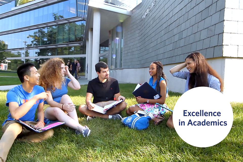 Students seated in a circle outside of the Skyline residence hall