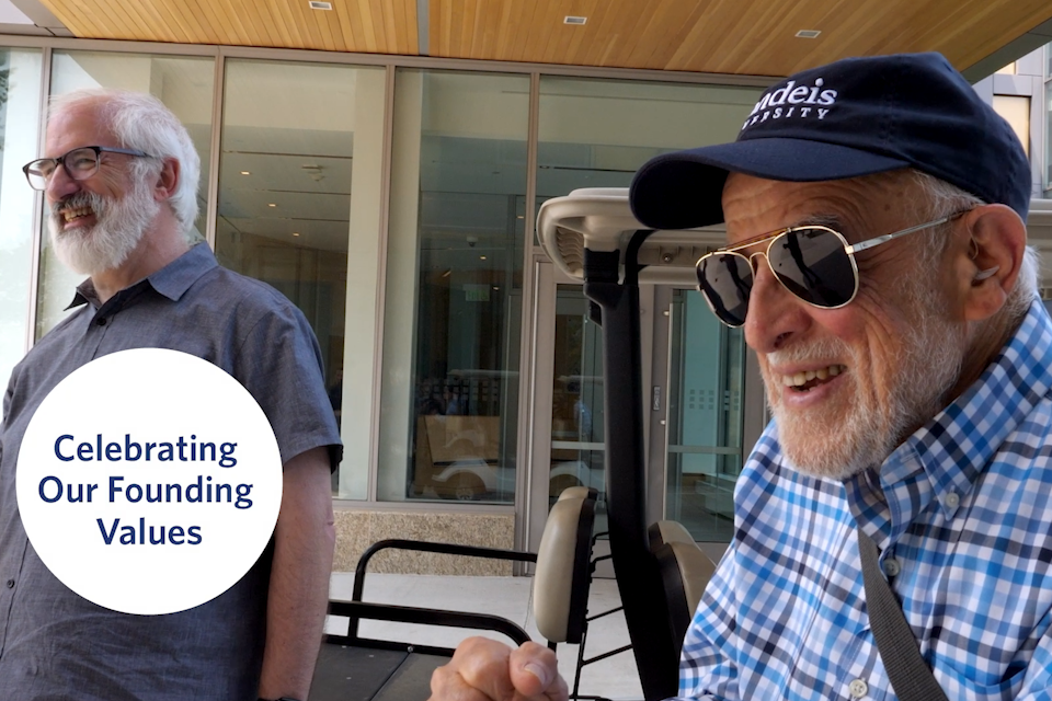 Lewis Brooks and Max Perlitsh next to a golf cart 