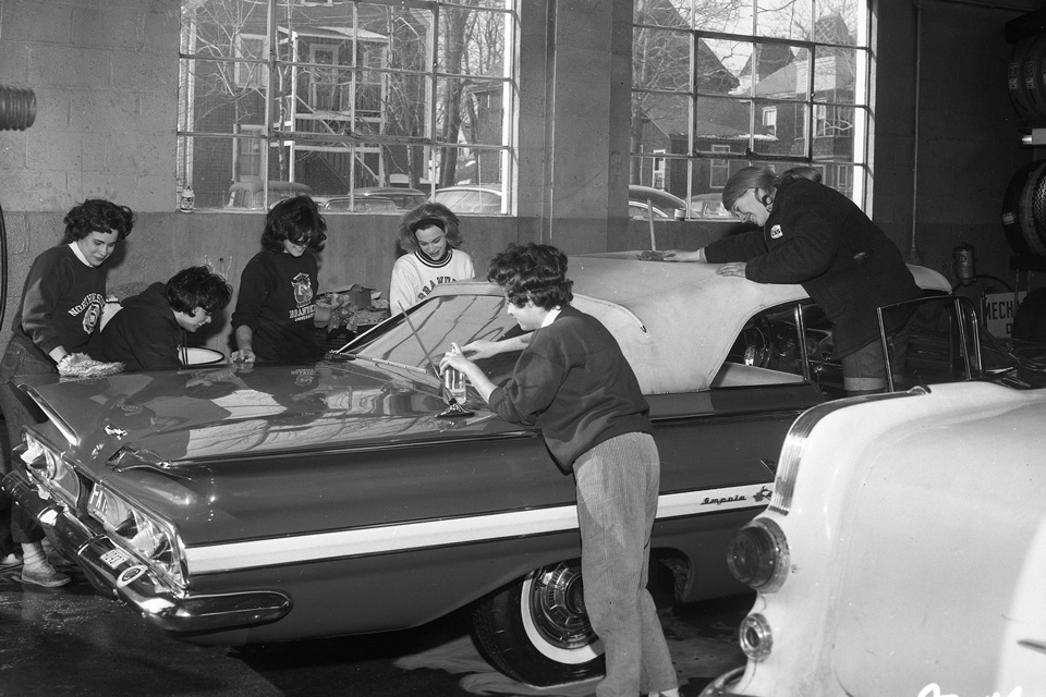 Students washing a car