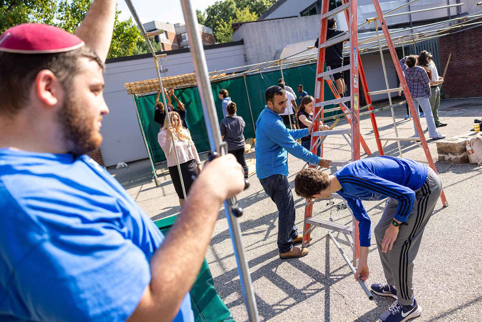 Students build sukkah