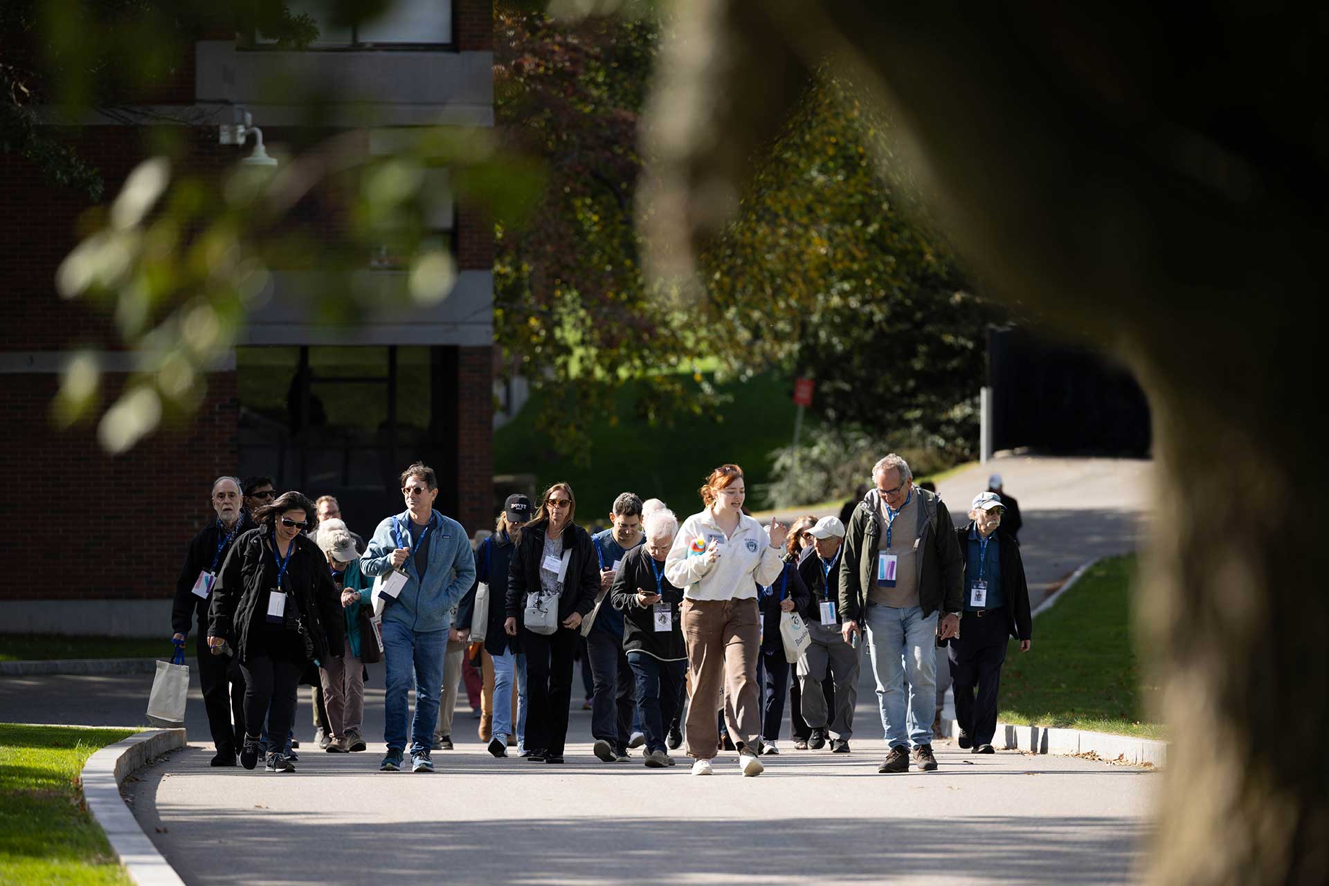 Alumni walk through campus during the 75th anniversary celebration