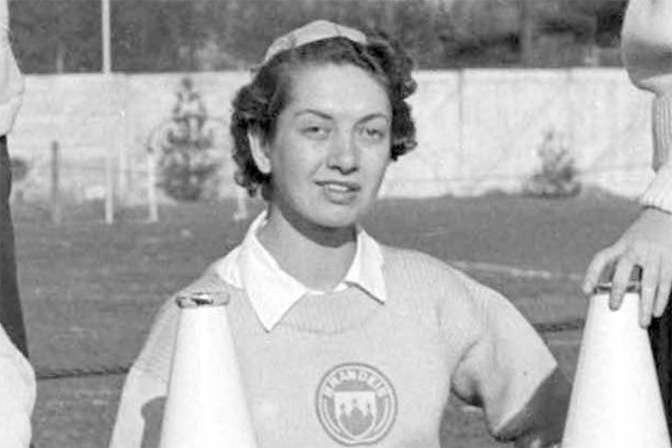 Black and white photo of Diana in a cheerleading uniform