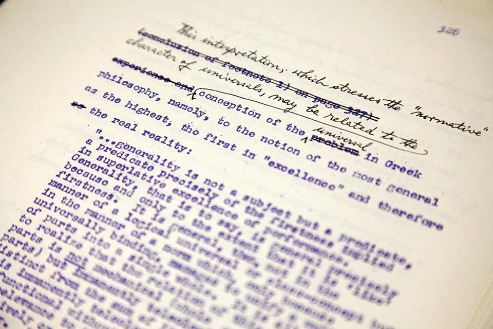 Photo of a typewritten manuscript page with handwritten edits.
