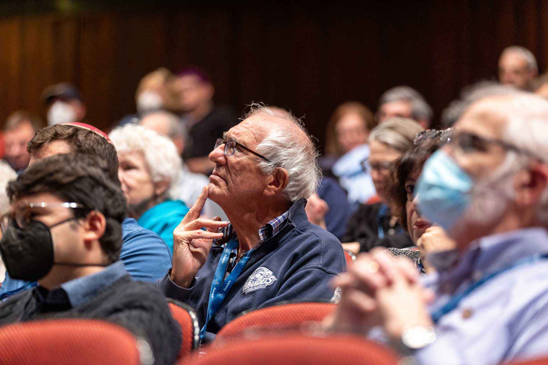 Audience members listen to a panel discussion.