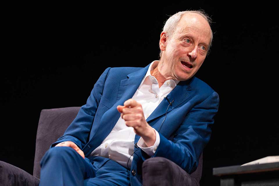 Michael Sandel speaks during a panel discussion.
